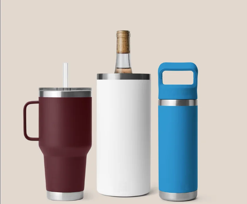 Insulated drinkware: a maroon travel tumbler, a white wine chiller and a blue water bottle