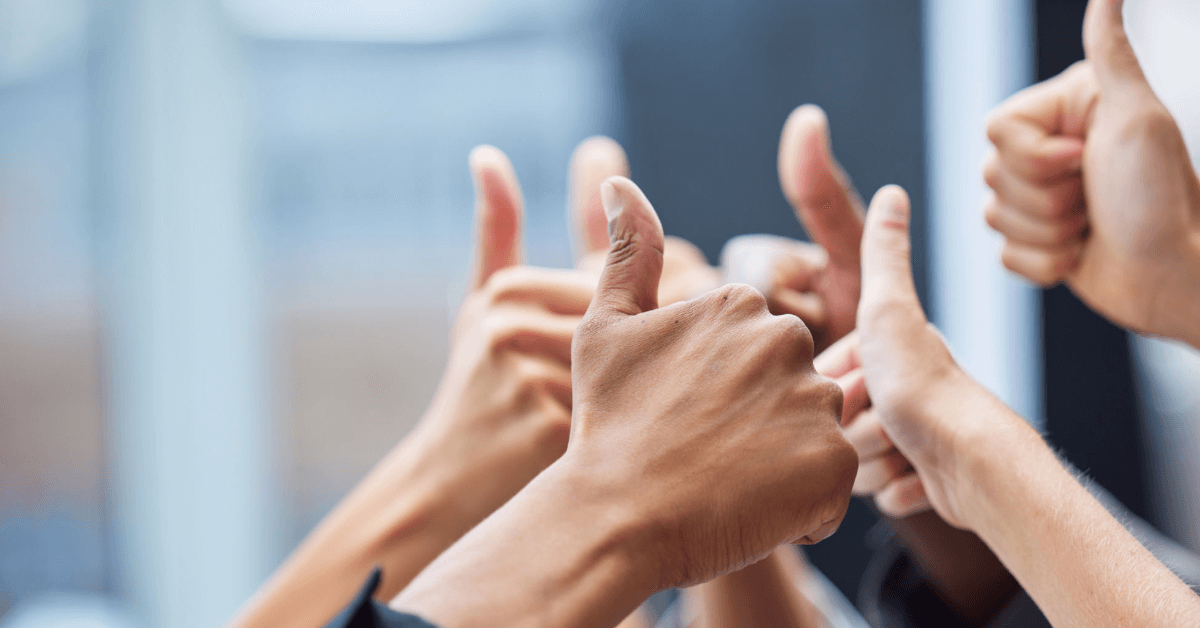 a bunch of people doing thumbs up