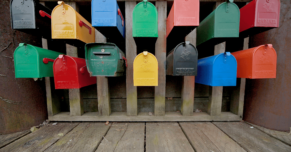 a bunch of colorful mailboxes