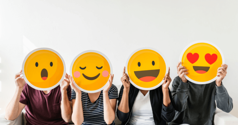 people holding smiley faces